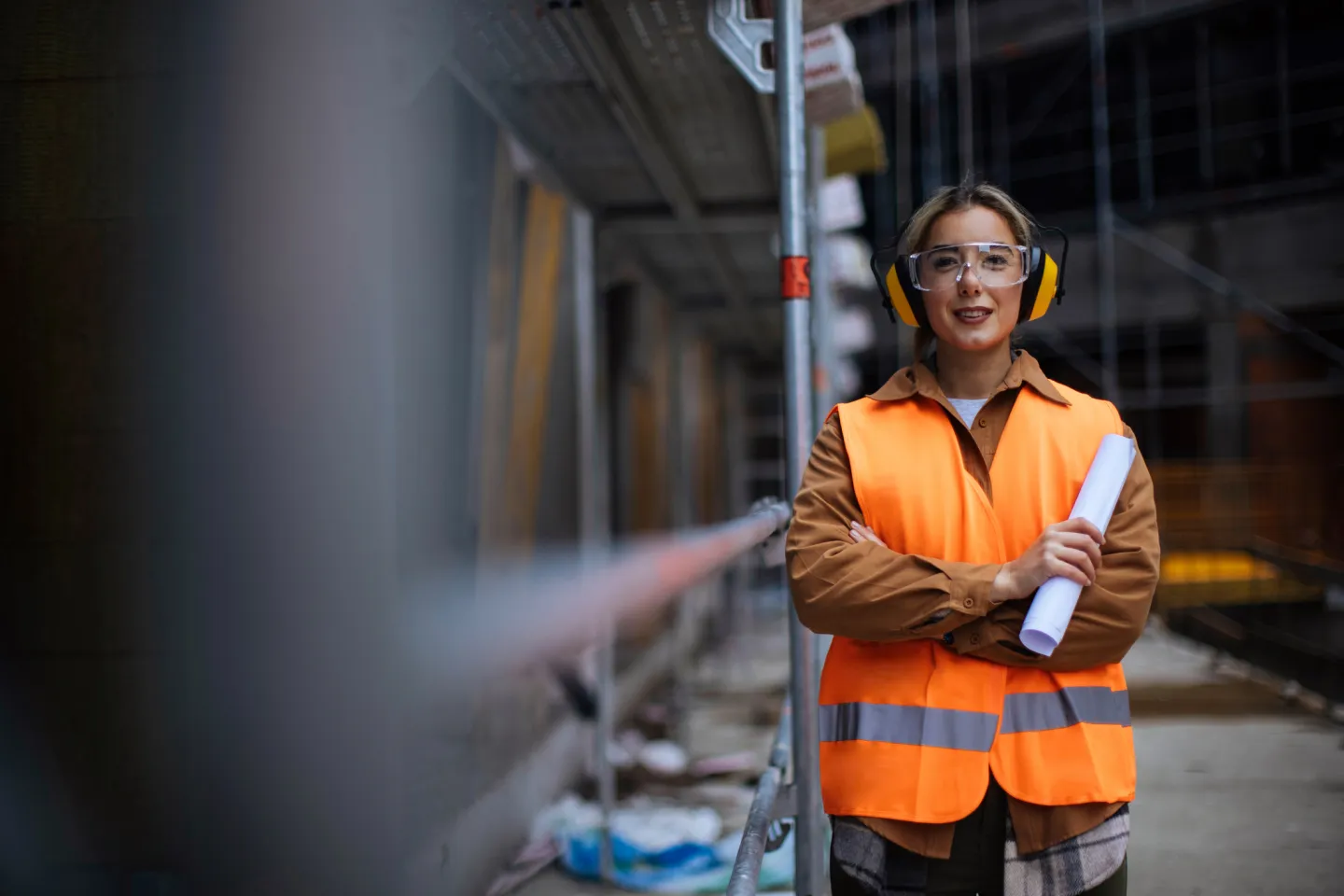 A construction worker wearing safety gear